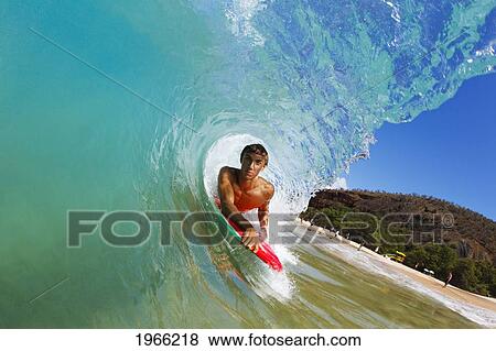 Hawaii, Maui, Makena - Big Beach, Boogie Boarder Riding Barrel Of Beautiful Wave Along Shore. View Large Photo Image Stock Photo - Hawaii, Maui, Makena - Big Beach, Boogie Boarder Riding Barrel Of Beautiful Wave Along Shore.. Fotosearch