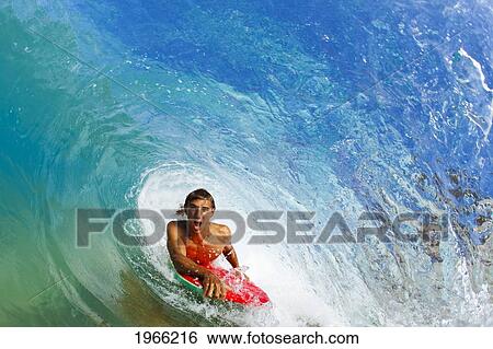 Stock Photograph - Hawaii, Maui, Makena - Big Beach, Boogie Boarder Riding Barrel Of Beautiful Wave.. Fotosearch