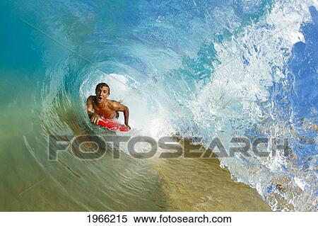 Hawaii, Maui, Makena - Big Beach, Boogie Boarder Riding Barrel Of Beautiful Wave. View Large Photo Image Stock Photography - Hawaii, Maui, Makena - Big Beach, Boogie Boarder Riding Barrel Of Beautiful Wave.. Fotosearch