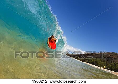 Stock Image - Hawaii, Maui, Makena - Big Beach, Young Man Boogie Boarding On Beautiful Wave.. Fotosearch