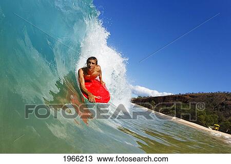 Stock Image - Hawaii, Maui, Makena - Big Beach, Young Man Boogie Boarding On Beautiful Wave.. Fotosearch