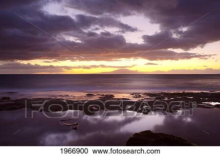 Stock Image - Hawaii, Maui, Makena, Dramatic Vibrant Sunset On The Beach In South Maui. Fotosearch