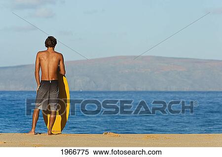 Hawaii, Maui, Makena, Skimboarder At On The Beach Looking Out At Ocean View Large Photo Image Stock Photography - Hawaii, Maui, Makena, Skimboarder At On The Beach Looking Out At Ocean. Fotosearch