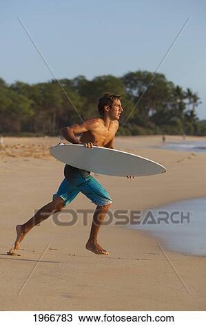 Hawaii, Maui, Makena, Skimboarder Running Into The Ocean View Large Photo Image Stock Image - Hawaii, Maui, Makena, Skimboarder Running Into The Ocean. Fotosearch