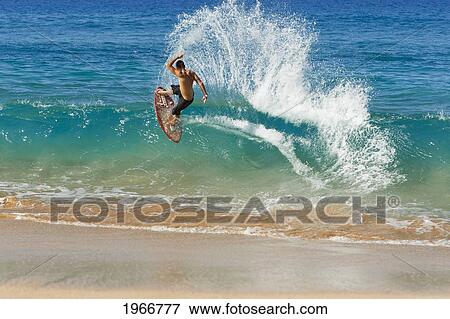 Hawaii, Maui, Makena, Skimboarder Carves Big Turn On Wave View Large Photo Image Stock Photo - Hawaii, Maui, Makena, Skimboarder Carves Big Turn On Wave. Fotosearch