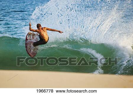 Stock Photo - Hawaii, Maui, Makena, Skimboarder Carves Big Turn On Wave. Fotosearch