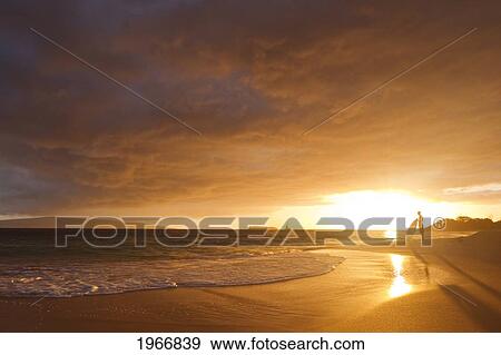Stock Photo - Hawaii, Maui, Makena, Skimboarder Silhouette At Sunset. Fotosearch