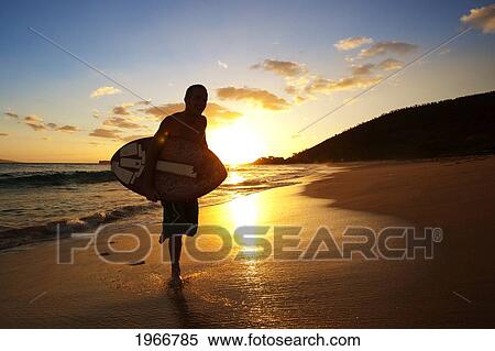 Stock Photography - Hawaii, Maui, Makena, Skimboarder Running Up The Beach. Fotosearch