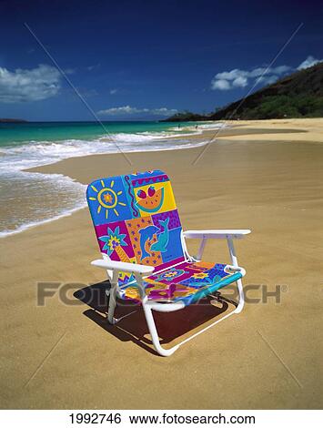 Hawaii, Maui, Makena State Park, Big Beach; Colorful Beach Chair On Beach With Calm Waves Washing Ashore Turquoise Water View Large Photo Image Stock Photograph - Hawaii, Maui, Makena State Park, Big Beach; Colorful Beach Chair On Beach With Calm Waves Washing Ashore Turquoise Water. Fotosearch