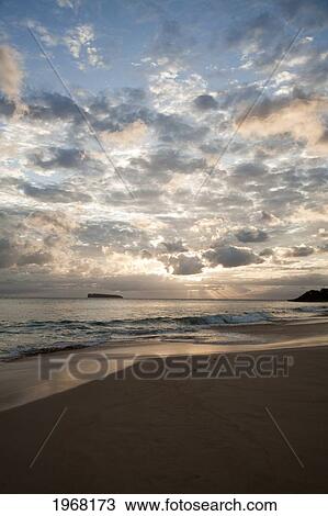 Stock Image - Hawaii, Maui, Makena State Park, Oneloa Or Big Beach, Water Lapping Onto Shore At Sunset.. Fotosearch