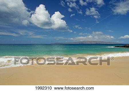 Stock Image - Hawaii, Maui, Makena State Park, Oneloa (Big Beach), West Maui Mountains In Distance.. Fotosearch