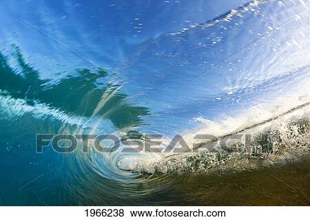 Stock Photo - Hawaii, Maui, Makena, View Through Tube Of Glassy Wave At Sunrise.. Fotosearch
