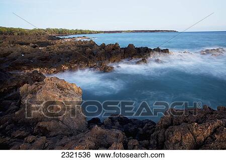 Hawaii, Maui, Makena, Waves Crash Against Lava Rock Cliffs. View Large Photo Image Stock Photograph - Hawaii, Maui, Makena, Waves Crash Against Lava Rock Cliffs.. Fotosearch