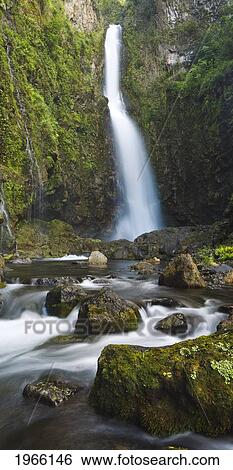 Stock Photograph - Hawaii, Maui, Nahiku, Hanawi Falls And Stream In Lush Valley.. Fotosearch