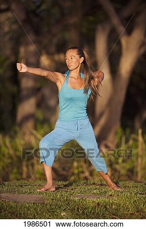 Hawaii, Maui, Olowalu, Woman Doing Yoga In Grass. View Large Photo Image Stock Image - Hawaii, Maui, Olowalu, Woman Doing Yoga In Grass.. Fotosearch