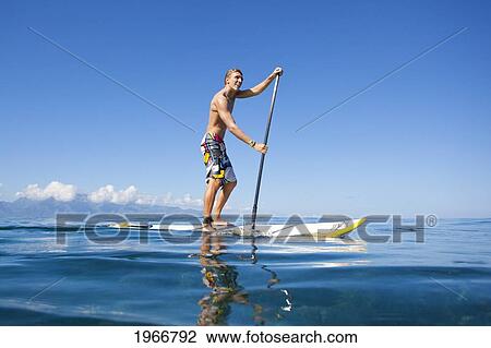 Hawaii, Maui, Paia, Athletic Stand Up Paddle Surfer In Maui's North Shore View Large Photo Image Stock Image - Hawaii, Maui, Paia, Athletic Stand Up Paddle Surfer In Maui's North Shore. Fotosearch