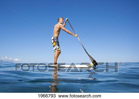 Hawaii, Maui, Paia, Athletic Stand Up Paddle Surfer In Maui's North Shore View Large Photo Image Stock Image - Hawaii, Maui, Paia, Athletic Stand Up Paddle Surfer In Maui's North Shore. Fotosearch