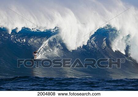 Stock Photo - Hawaii, Maui, Peahi Aka Jaws, Surfer Cruising On A Huge Wave.. Fotosearch