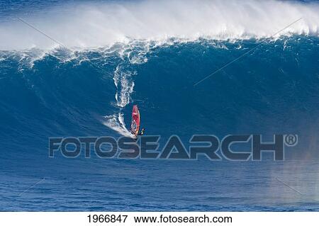 Stock Photo - Hawaii, Maui, Peahi (Jaws), Windsurfer Rides Large Wave. Fotosearch
