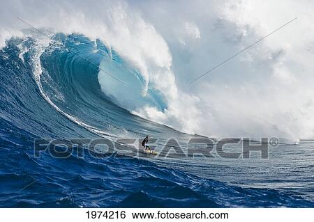 Stock Photograph - Hawaii, Maui, Peahi Or Jaws, Surfer On A Huge Wave.. Fotosearch