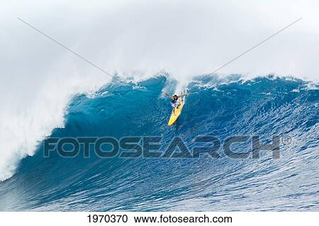 Stock Image - Hawaii, Maui, Peahi, Professional Surfer Danilo Couto Rides A Wave At Peahi, Also Know As Jaws. For Editorial Use Only.. Fotosearch