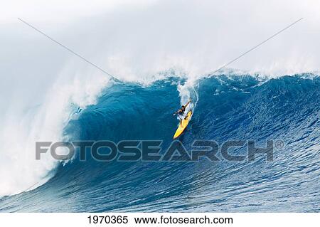 Stock Photography - Hawaii, Maui, Peahi, Professional Surfer Danilo Couto Rides A Wave At Peahi, Also Know As Jaws. For Editorial Use Only.. Fotosearch