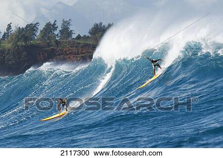 Hawaii, Maui, Peahi, Surfers ride a giant wave at Peahi also know as Jaws. EDITORIAL USE ONLY. View Large Photo Image Stock Image - Hawaii, Maui, Peahi, Surfers ride a giant wave at Peahi also know as Jaws. EDITORIAL USE ONLY.. Fotosearch