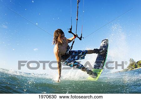 Hawaii, Maui, Professional Kiteboarder Jesse Richman Riding At Kitebeach. For Editorial Use Only. View Large Photo Image Stock Image - Hawaii, Maui, Professional Kiteboarder Jesse Richman Riding At Kitebeach. For Editorial Use Only.. Fotosearch
