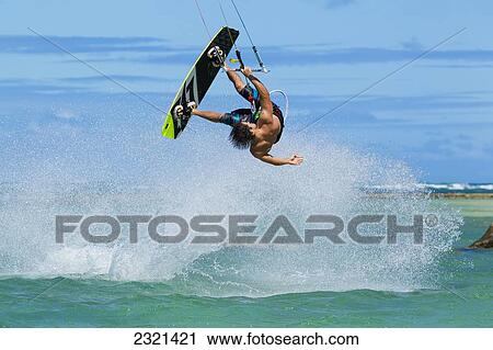 Stock Image - Hawaii, Maui, Professional Kiteboarder, Shawn Richman Kitesurfing On The North Shore. Editorial Use Only.. Fotosearch
