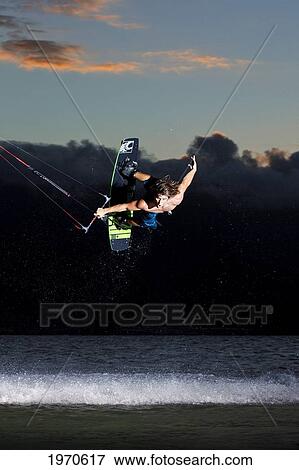 Hawaii, Maui, Professional Kiteboarder Jesse Richman Riding At Kitebeach At Night. For Editorial Use Only. View Large Photo Image Stock Photo - Hawaii, Maui, Professional Kiteboarder Jesse Richman Riding At Kitebeach At Night. For Editorial Use Only.. Fotosearch