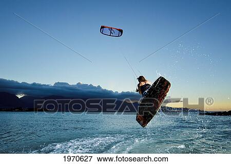 Stock Photo - Hawaii, Maui, Professional Kiteboarder Jesse Richman Riding At Kitebeach. For Editorial Use Only.. Fotosearch