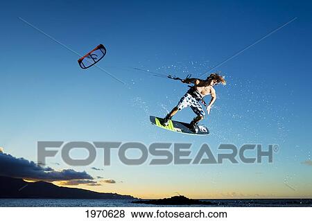 Stock Photo - Hawaii, Maui, Professional Kiteboarder Jesse Richman Riding At Kitebeach. For Editorial Use Only.. Fotosearch