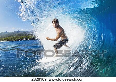 Stock Photo - Hawaii, Maui, Professional Surfer Ola Eleogram Surfing The Barrel Of A Wave. Editorial Use Only.. Fotosearch