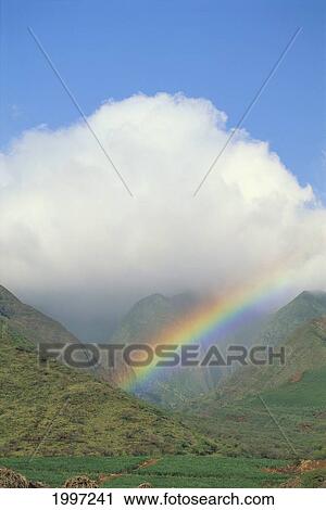 Hawaii, Maui, Rainbow Into West Maui Mountains, Large Puffy Cloud, Blue Sky A48F View Large Photo Image Stock Image - Hawaii, Maui, Rainbow Into West Maui Mountains, Large Puffy Cloud, Blue Sky A48F. Fotosearch