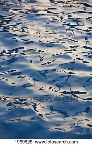 Stock Photo - Hawaii, Maui, Reflections In Turquoise Ocean Water.. Fotosearch