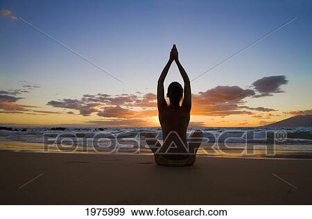 Stock Photo - Hawaii, Maui, Silhouette Of Beautiful Girl Doing Yoga On The Beach.. Fotosearch