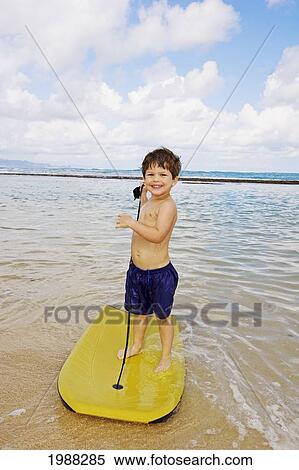 Hawaii, Maui, Spreckelsville, Baby Beach, Young Boy Playing In The Water On A Boogieboard View Large Photo Image Stock Photography - Hawaii, Maui, Spreckelsville, Baby Beach, Young Boy Playing In The Water On A Boogieboard. Fotosearch