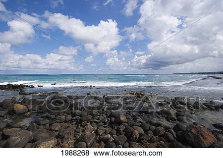 Stock Photo - Hawaii, Maui, Spreckelsville, Rocky Shore, Gorgeous Blue Ocean And Cloudy Sky. Fotosearch