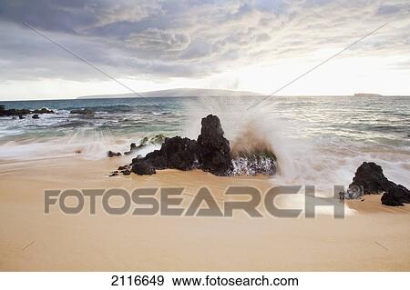 Stock Photo - Hawaii, Maui, Surf crashes onto Big Beach.. Fotosearch