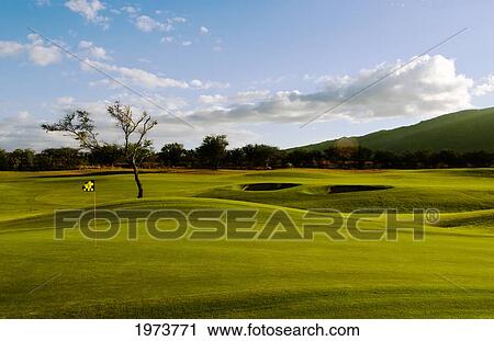 Stock Image - Hawaii, Maui, The Dunes In Maui Lani, Hole Number 17 At Sunset.. Fotosearch