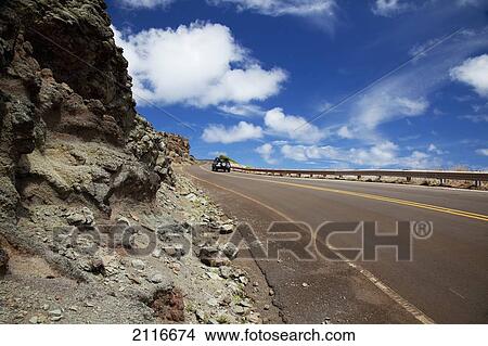 Picture - Hawaii, Maui, Vehicle on the open road and blue skies on the West Side.. Fotosearch