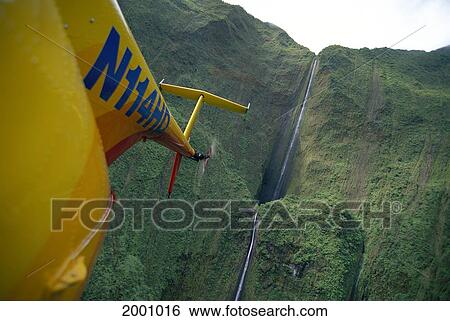 Stock Photograph - Hawaii, Maui, View From Helicopter Tall Thin Waterfall Along West Maui Mountains. Fotosearch
