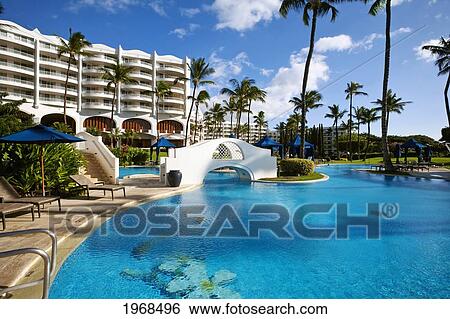 Stock Photograph - Hawaii, Maui, Wailea, Fairmont Kea Lani Hotel, View Of The Pool With Hotel In The Background.. Fotosearch