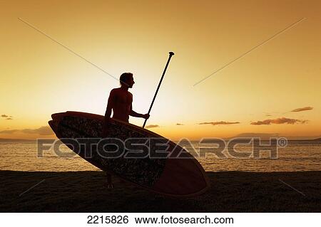 Hawaii, Maui, Wailea, Silhouette of Young Man with Stand Up Paddle Board at Sunset View Large Photo Image Stock Photograph - Hawaii, Maui, Wailea, Silhouette of Young Man with Stand Up Paddle Board at Sunset. Fotosearch