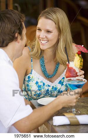 Hawaii, Maui, Wailea, Tommy Bahama's Tropical Cafe, Caucasian Couple Enjoying Drinks Together. View Large Photo Image Stock Image - Hawaii, Maui, Wailea, Tommy Bahama's Tropical Cafe, Caucasian Couple Enjoying Drinks Together.. Fotosearch