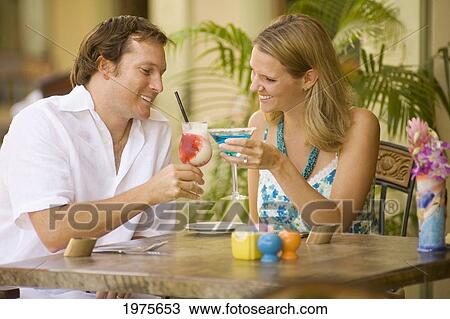 Hawaii, Maui, Wailea, Tommy Bahama's Tropical Cafe, Caucasian Couple Enjoying Drinks Together. View Large Photo Image Stock Image - Hawaii, Maui, Wailea, Tommy Bahama's Tropical Cafe, Caucasian Couple Enjoying Drinks Together.. Fotosearch