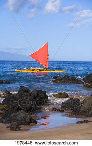 Stock Photograph - Hawaii, Maui, Wailea, Traditional Hawaiian Sailing Canoe Off Coastline.. Fotosearch