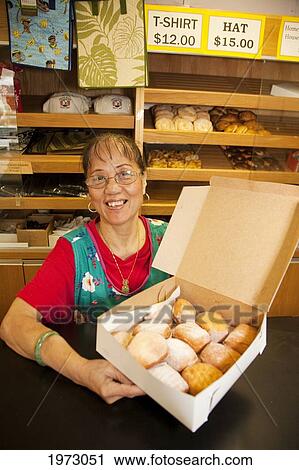 Stock Image - Hawaii, Maui, Wailuku, Home Made Bakery, Fresh Malasadas (Local Hawaiian Pastry. ). Fotosearch
