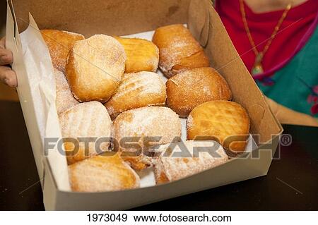 Hawaii, Maui, Wailuku, Home Made Bakery, Fresh Malasadas (Local Hawaiian Pastry. ) View Large Photo Image Stock Photo - Hawaii, Maui, Wailuku, Home Made Bakery, Fresh Malasadas (Local Hawaiian Pastry. ). Fotosearch