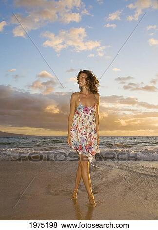 Stock Photo - Hawaii, Maui, Woman Standing On The Shore Of Remote Tropical Location.. Fotosearch
